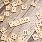 scrabble-letters-spelling-saas-on-a-wooden-tabl