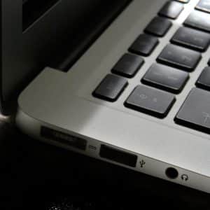 Free Detailed view of a silver laptop showing keyboard and multiple ports. Stock Photo
